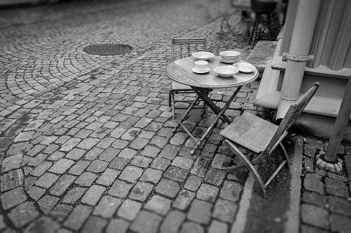 Picnic table in city enviroment, black and white processed
