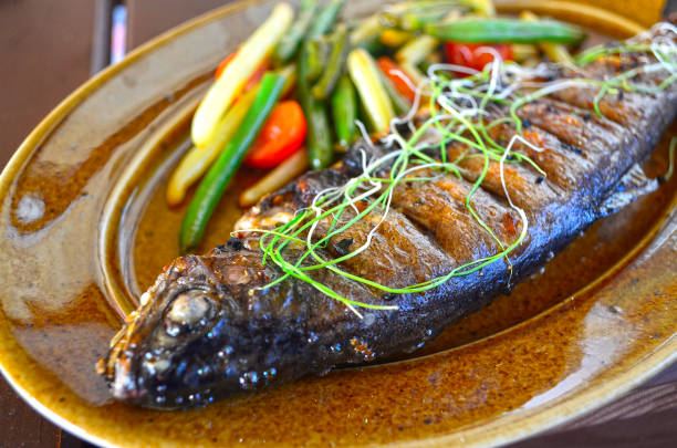 istock Baked trout with vegetables, restaurant serving. 1302523132
