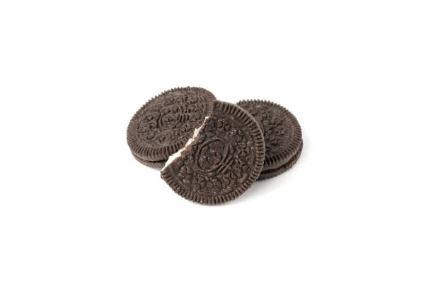 istock Chocolate cookies with a sweet cream isolated on a white background. Flat lay 1302524921