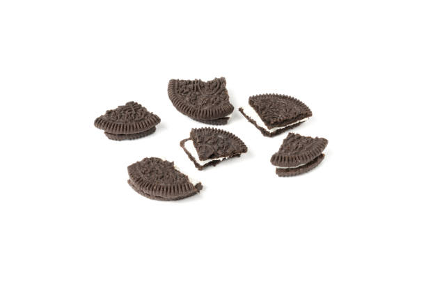 istock Chocolate cookies with a crumbs isolated on a white background. Flat lay 1302524926