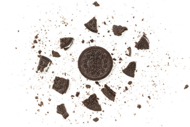 istock Chocolate cookies with a crumbs isolated on a white background. Flat lay 1302524972