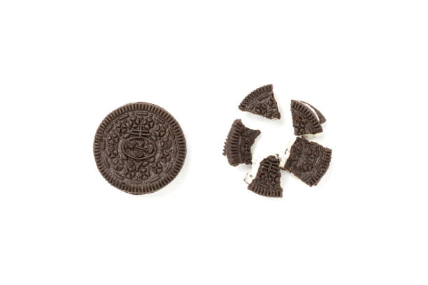 istock Chocolate cookies with a sweet cream isolated on a white background. Flat lay 1302524982