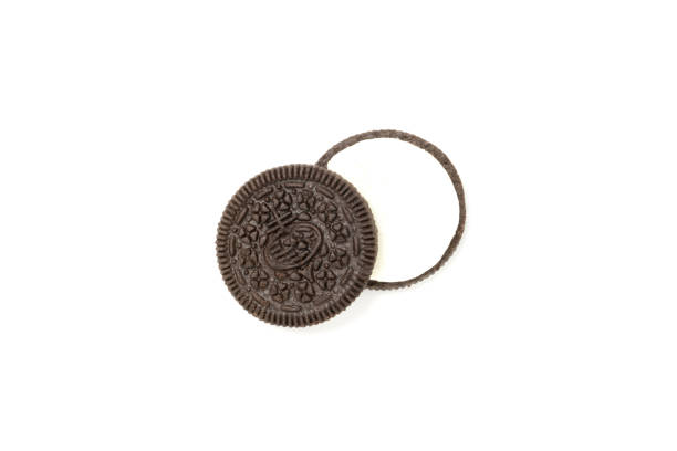 istock Chocolate cookies with a crumbs isolated on a white background. Flat lay 1302524986