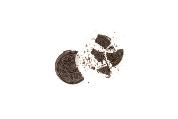 istock Chocolate cookies with a crumbs isolated on a white background. Flat lay 1302524992