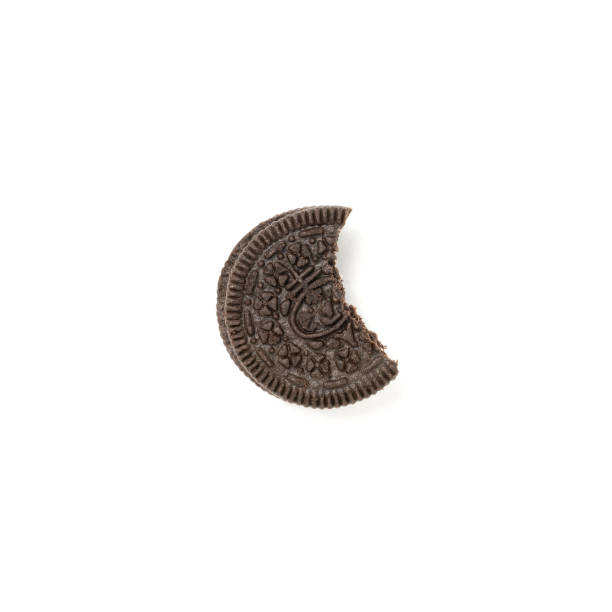 istock Chocolate cookies with a crumbs isolated on a white background. Flat lay 1302525014