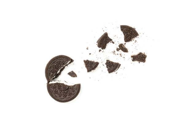 istock Chocolate cookies with a crumbs isolated on a white background. Flat lay 1302525021