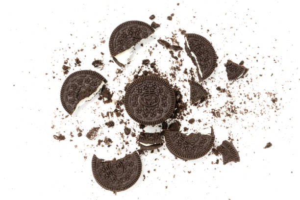 istock Chocolate cookies with a crumbs isolated on a white background. Flat lay 1302525033