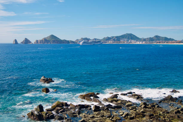 El Arco, Cabo coastline and cruise ships stock photo