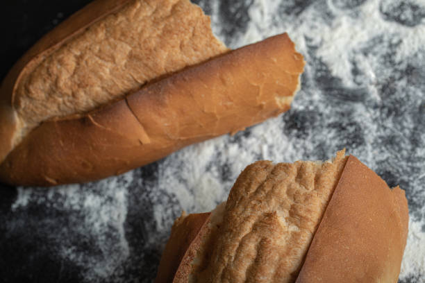 istock Top view of freshly baked bread on blackboard 1302531659
