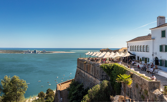 Setúbal, Portugal - August 29, 2020: The São Filipe fort was built in the 16th century and is located in the Arrábida Natural Park and overlooking the city of Setúbal.\nFrom the fort we have superb views over the city, the estuary and mouth of the Sado River and also over the Troia Peninsula.\nCurrently there is an inn and a bar with a terrace in the fort.