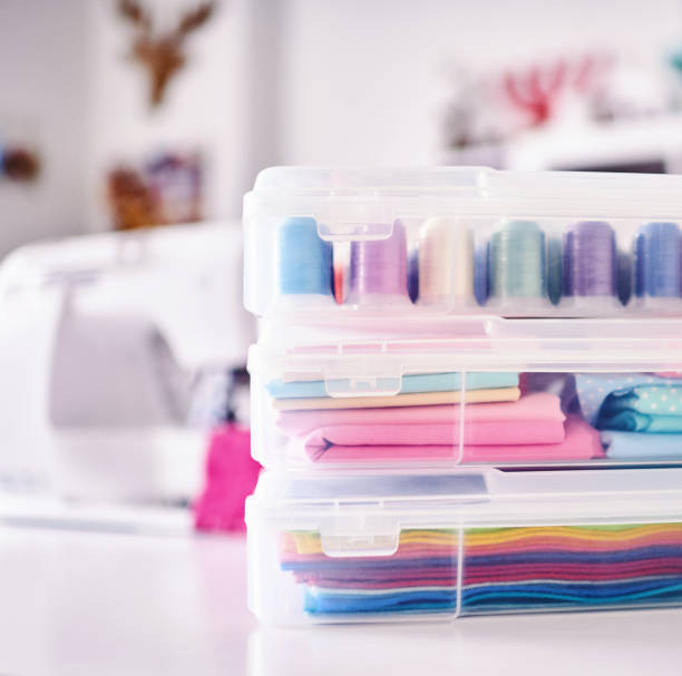 istock Sewing machine and craft supplies in modern bright craft room 1302536757