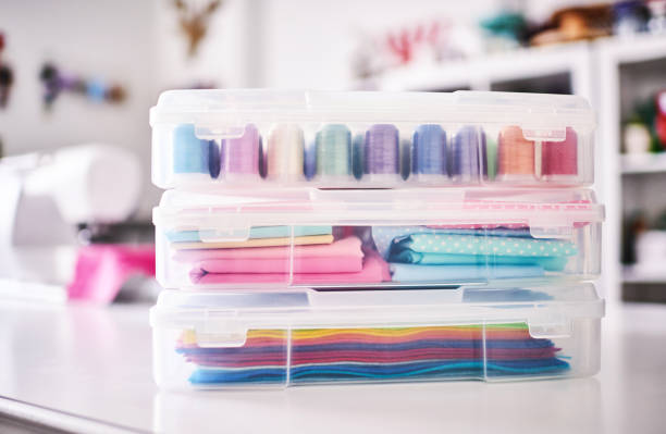 istock Sewing machine and craft supplies in modern bright craft room 1302536781