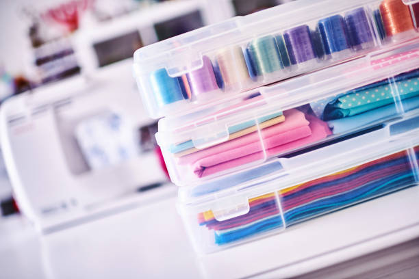 istock Sewing machine and craft supplies in modern bright craft room 1302536820