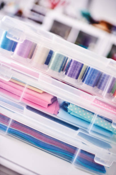 istock Sewing machine and craft supplies in modern bright craft room 1302536837