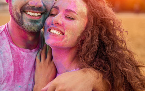 istock Happy couple hugging during party 1302538575