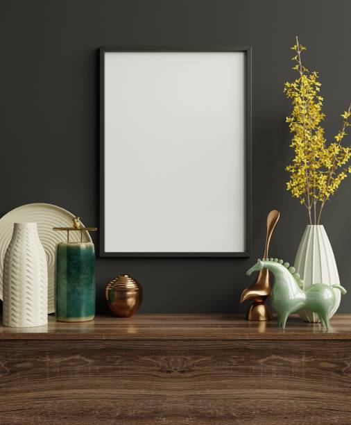 istock Mockup frame on cabinet in living room interior on empty dark wall background. 1302541872