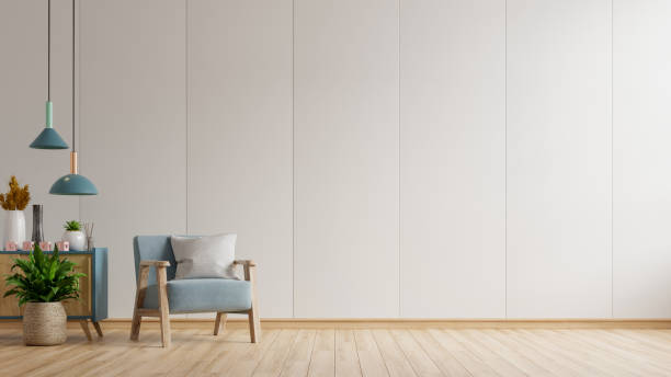 istock The interior has a blue armchair on empty white wall background. 1302541936