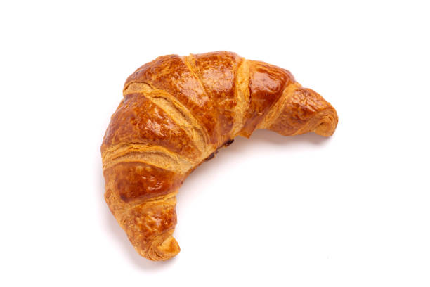 istock Delicious fresh croissant isolated on white background 1302547488
