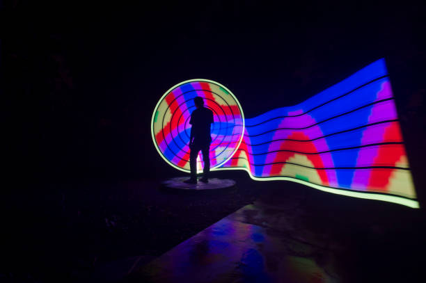 istock People with beautiful light painting artwork 1302547601