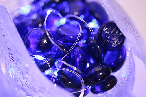 Small blue glass stones with lights around them.
