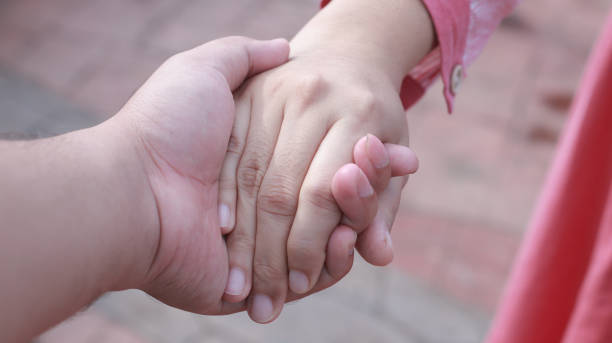 istock Loving Couples holding each other's hands, happy moment  together 1302550422