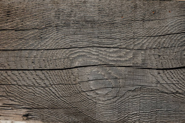 黒と濃い茶色の古い木の質感。結び目のある古いボード。古いボードクローズアップの広い質感。納屋の質感。木の質感は背景として使用することができる - wood rustic close up nail ストックフォトと画像