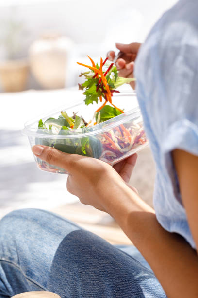 istock Woman Eating Salad 1302556729