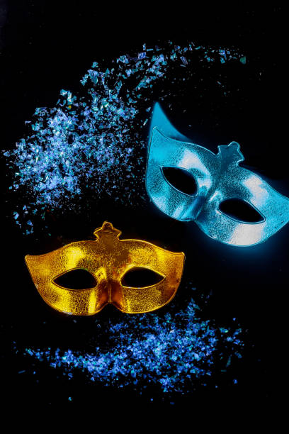 istock Carnival masks on black background. Jewish Purim. 1302557714