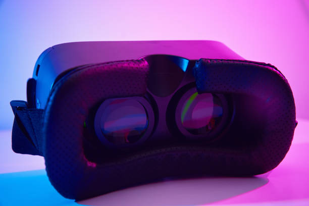 istock Virtual reality glasses on colorful background. Future technology, VR concept 1302558644