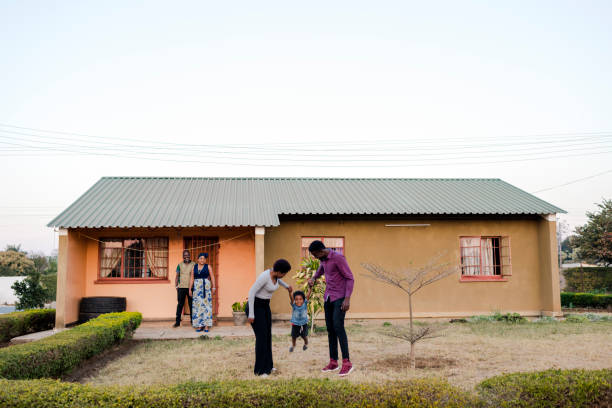 istock Three Generations Family playing outside their home 1302559339