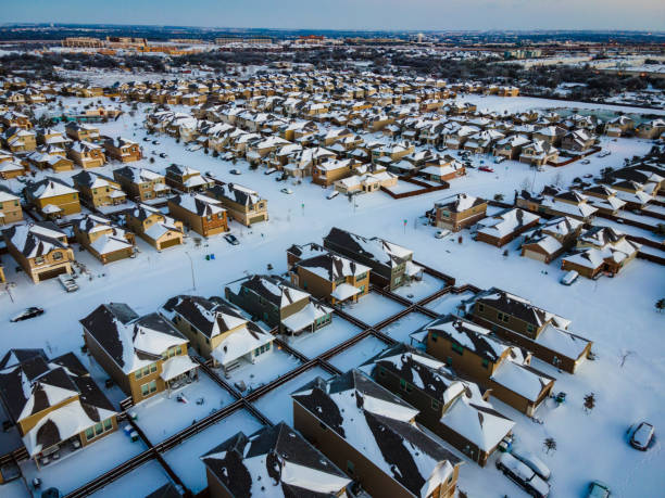 istock Snow covering suburb homes 1302560250