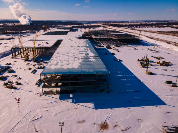 Tesla GigaFactory in Austin Texas Covered in Snow austin , texas , usa - febuary 16th 2021 snow covered tesla giga factory in Austin after winter storm Uri dumped a record breaking snow fall over central texas during Winter Storm Uri elon musk photos stock pictures, royalty-free photos & images