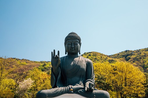 The Big Buddha statue located on Phuket Island, Thailand. This iconic landmark, known as the Great Buddha of Phuket, sits atop Nakkerd Hill near Chalong and is visible from far away due to its large size and elevation. The statue is a significant religious site and a popular tourist attraction, offering panoramic views of the island.