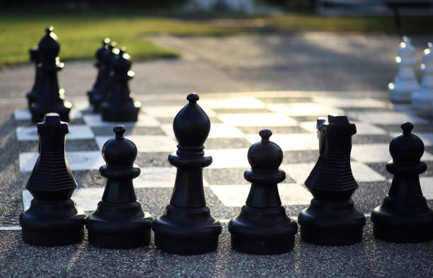 istock Huge chess figures outdoor on floor 1302563946
