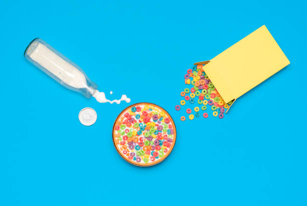 istock Cereal bowl with milk, top view. Breakfast with multicolored cereals and milk. 1302565188