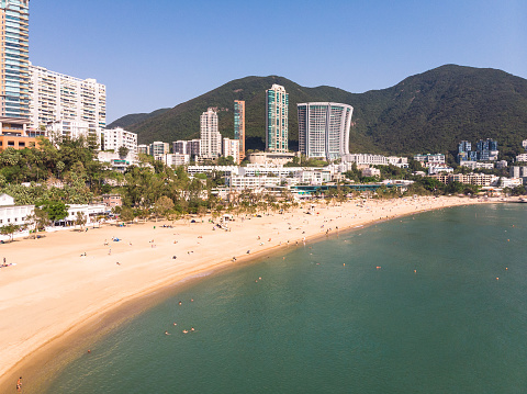 Aerial view of the famous Repulse bay sandy beach and skyline in Hong Kong island by the South China Sea