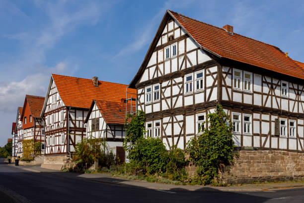 Half timbered houses in the village of Herleshausen in germany Herleshausen, Hesse, Germany - October 01, 2020: Half timbered houses in the village of Herleshausen in Germany timber framed stock pictures, royalty-free photos & images