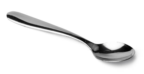 istock Silver spoon isolated on white background close up 1302572942
