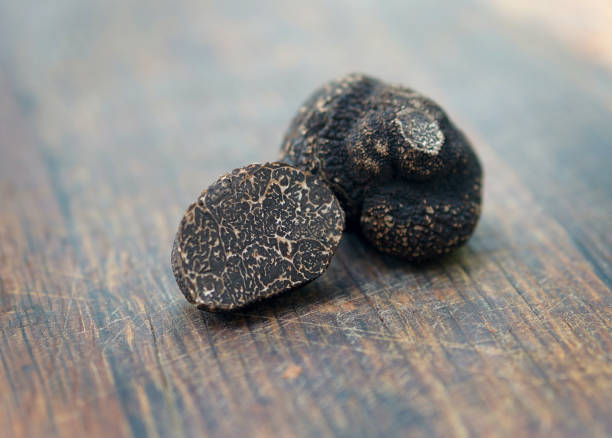 istock Truffles on a wooden background 1302576551