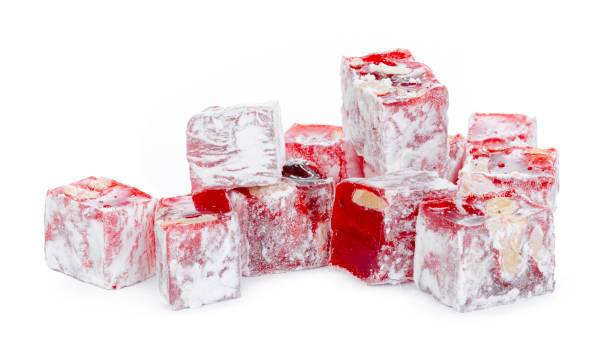istock Close up of red Turkish Delight sweets isolated on white 1302576640