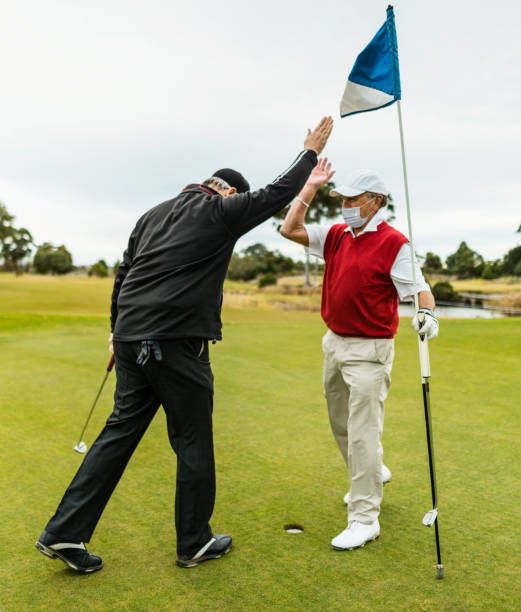 istock golf player hitting the ball with face mask 1302580298
