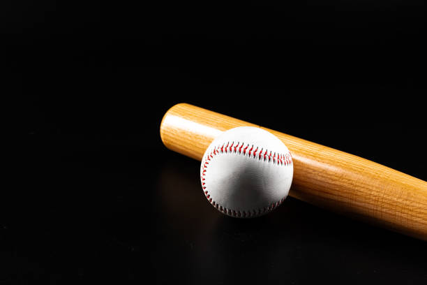istock Baseball game equipment on dark black background 1302581452