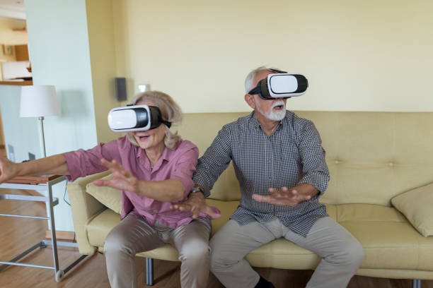 istock Competitive Senior Couple Playing 3D Games 1302582307