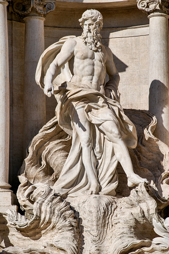 The detail of the statue of the Ocean, by the sculptor Pietro Bracci (1700-1773), in the center of the majestic Trevi Fountain, in the historic center of Rome. Built in 1732 on the wishes of Pope Clement XII, the Trevi Fountain it's one of the masterpiece of the late Roman Baroque, recognized as one of the most beautiful and famous fountain in the world. Built on the facade of the Palazzo Poli by the architect Nicola Salvi, it was inaugurated in 1762. Image in High Definition format.