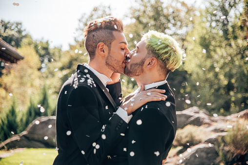 gay couple kissing for the marriage