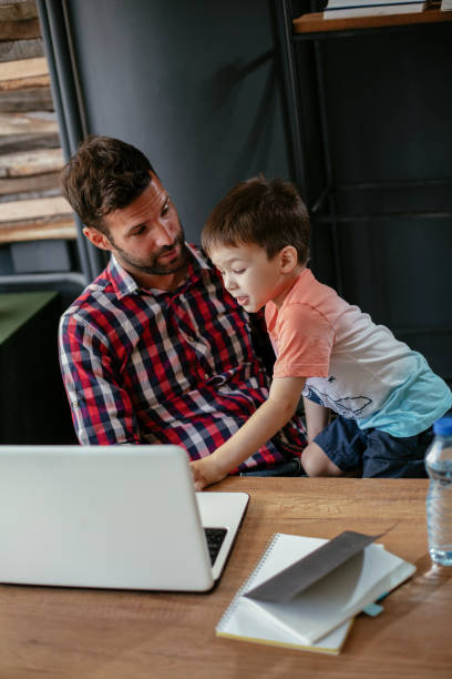 istock Young businessman with his son in the office 1302593167