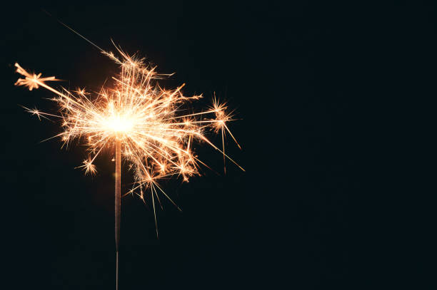 Burning party sparkler isolated on black background. Bengal Burning party sparkler isolated on black background. Bengal sparkler stock pictures, royalty-free photos & images