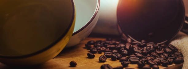 Black cups 2bowl and coffee beans with  beautiful light concept healthy by caffeine.For web banner.
