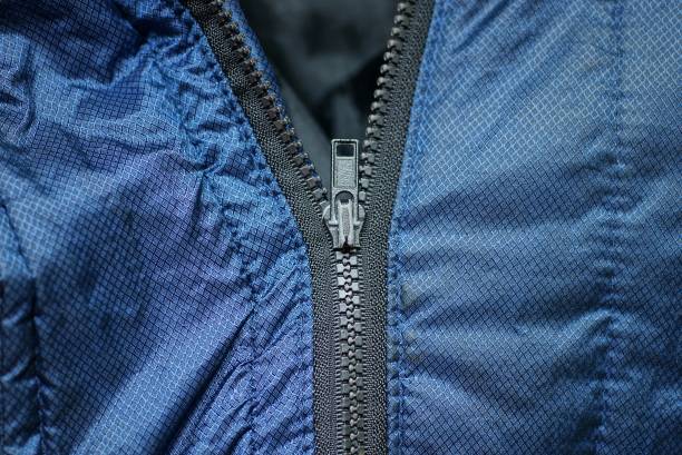 istock metallic zip on blue synthetic clothing fabric 1302594144
