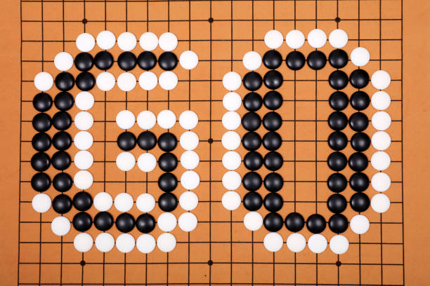 istock chinese game go,  Gobang and go game board 1302599141
